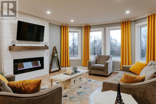 265 Main Street, Wing'S Point, NL - Indoor Photo Showing Living Room With Fireplace