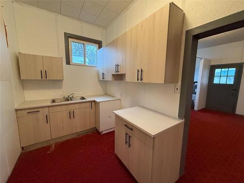 230 2Nd Avenue, Mccreary, MB - Indoor Photo Showing Kitchen With Double Sink