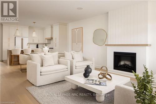 70C - 586 Seneca Drive, Fort Erie (333 - Lakeshore), ON - Indoor Photo Showing Living Room With Fireplace