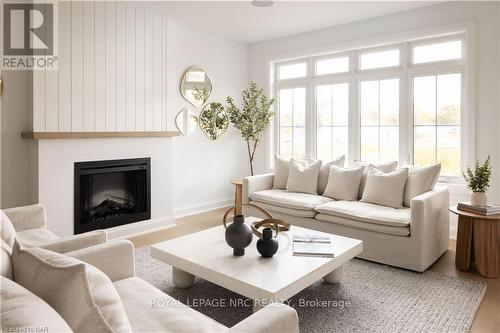 70C - 586 Seneca Drive, Fort Erie (333 - Lakeshore), ON - Indoor Photo Showing Living Room With Fireplace