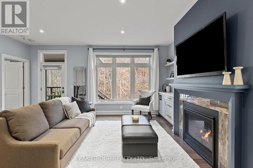 2 - 9245 Shoveller Drive, Niagara Falls (219 - Forestview), ON - Indoor Photo Showing Living Room With Fireplace