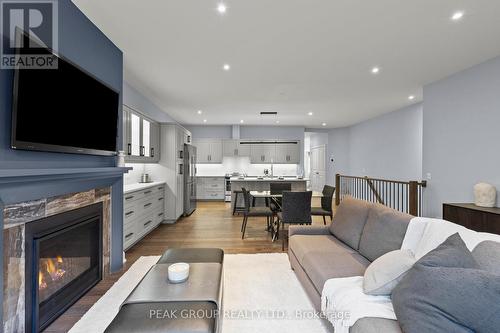 2 - 9245 Shoveller Drive, Niagara Falls (219 - Forestview), ON - Indoor Photo Showing Living Room With Fireplace