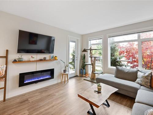 107-6540 Metral Dr, Nanaimo, BC - Indoor Photo Showing Living Room With Fireplace