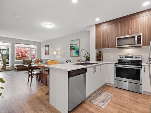 107-6540 Metral Dr, Nanaimo, BC - Indoor Photo Showing Kitchen With Stainless Steel Kitchen