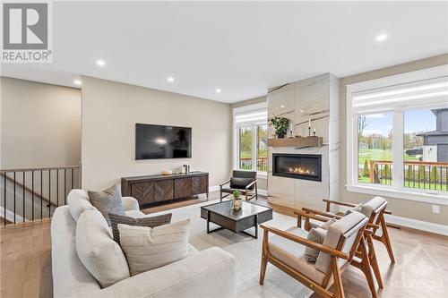 500 Shoreway Drive, Greely, ON - Indoor Photo Showing Living Room With Fireplace