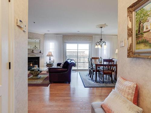 Hall - 25 Rue Des Manoirs, Charlemagne, QC - Indoor Photo Showing Living Room With Fireplace