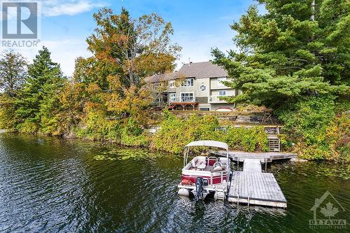 Gracious 4 bedroom, 3 full bathroom home with 7 acres on Long Lake - 4055 Hanley Lane, Perth, ON - Outdoor With Body Of Water