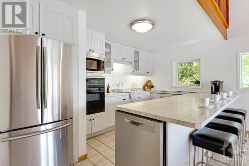 Contemporary white bright kitchen with large island-breakfast bar - 4055 Hanley Lane, Perth, ON - Indoor Photo Showing Kitchen