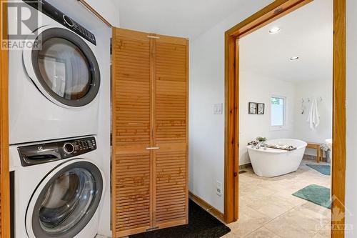 Main floor laundry station with new 2021 washer and dryer - 4055 Hanley Lane, Perth, ON - Indoor Photo Showing Laundry Room