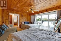 Lower level's other bedroom with patio doors to deck. - 