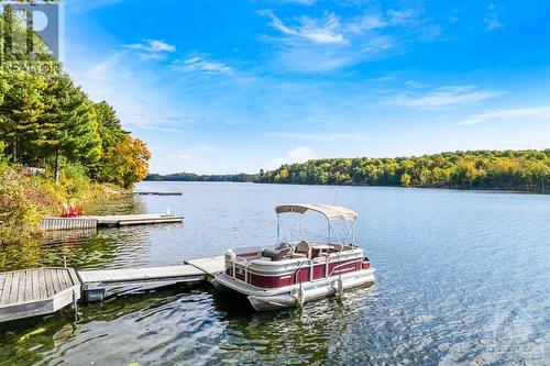 Dock approx 8' deep at end - 4055 Hanley Lane, Perth, ON - Outdoor With Body Of Water With View