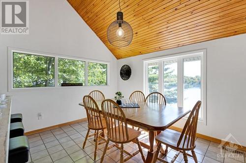 Kitchen's dinette with patio door to deck, looking east over the lake - 4055 Hanley Lane, Perth, ON - Indoor Photo Showing Dining Room