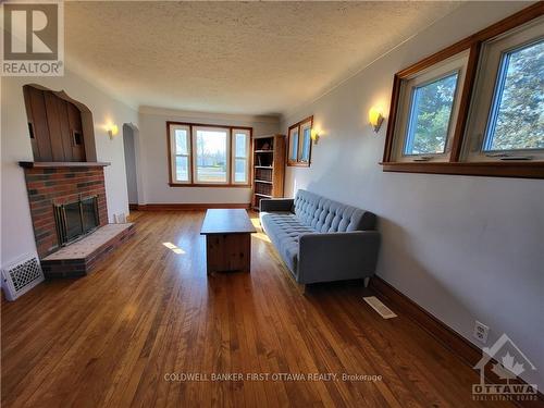 5687 First Line Road, Ottawa, ON - Indoor Photo Showing Living Room With Fireplace