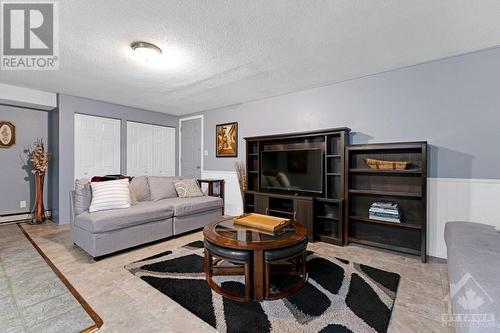 Lower level has  laminate and ceramic tile - 479 Drummond Concession 11 Road, Carleton Place, ON - Indoor Photo Showing Living Room