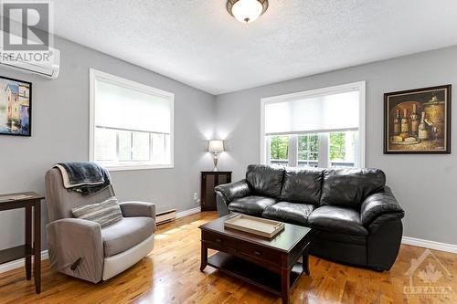 Light reflects off the hardwood flooring - 479 Drummond Concession 11 Road, Carleton Place, ON - Indoor Photo Showing Living Room