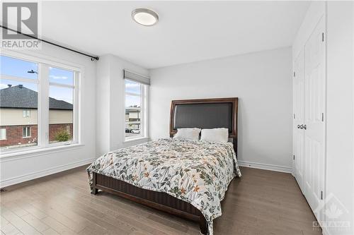 Bedroom w/ double closet and window facing Big Dipper St. - 272 Big Dipper Street, Ottawa, ON - Indoor Photo Showing Bedroom