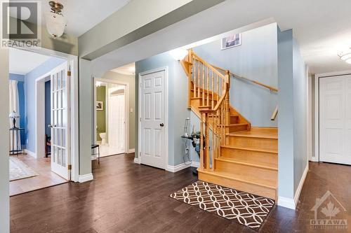 Oak staircase to living-dining, kitchen and two more bedrooms - 28 Mountain View Lane, Westport, ON - Indoor Photo Showing Other Room