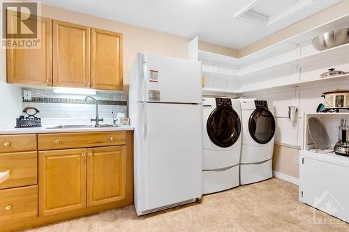 Big Butler pantry provides lots of storage, sink, desk station and laundry centre - 28 Mountain View Lane, Westport, ON - Indoor Photo Showing Laundry Room