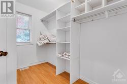 Ensuite walk-in closet with window - 