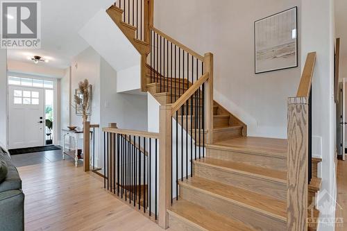 Oak staircase to second floor - 27 Shelter Cove Drive, Westport, ON - Indoor Photo Showing Other Room