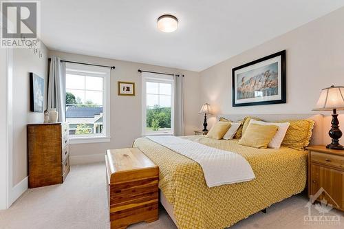 Primary bedroom full of natural light - 27 Shelter Cove Drive, Westport, ON - Indoor Photo Showing Bedroom