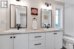 Second floor 5-piece bathroom with two-sink vanity - 