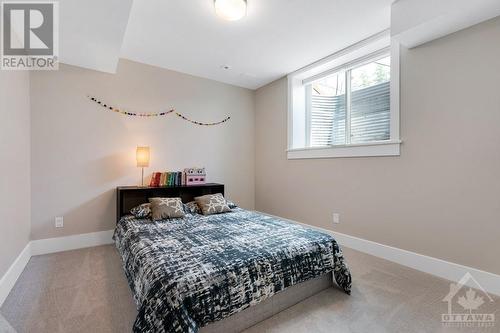 Lower level has home's 4th bedroom - 27 Shelter Cove Drive, Westport, ON - Indoor Photo Showing Bedroom