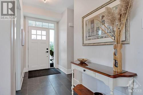 Bright light foyer has convenient walk-in closet - 27 Shelter Cove Drive, Westport, ON - Indoor Photo Showing Other Room