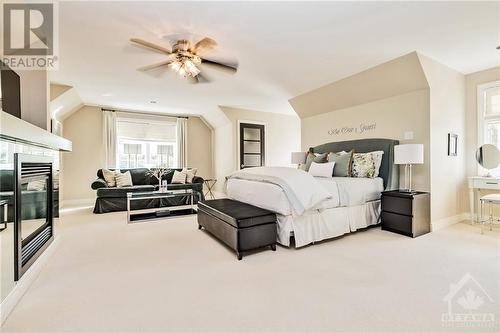 6197 Ottawa Street, Richmond, ON - Indoor Photo Showing Bedroom With Fireplace