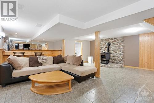 Lower level family room - 9334 Branch Road, North Augusta, ON - Indoor Photo Showing Living Room With Fireplace