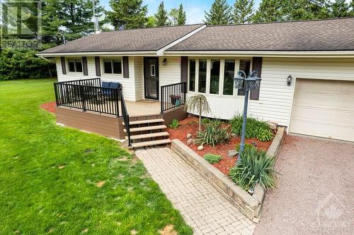 Landscaped gardens lead to welcoming front deck - 9334 Branch Road, North Augusta, ON - Outdoor