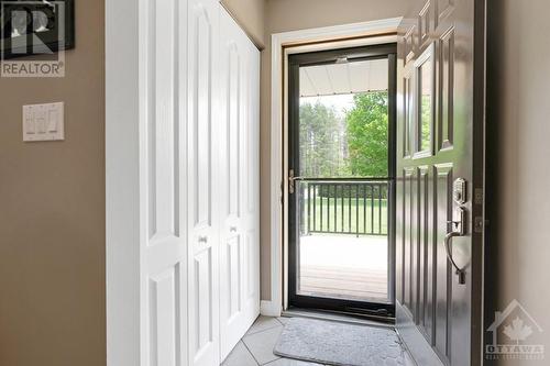 Front foyer has closet and pull down screen on door - 9334 Branch Road, North Augusta, ON - Indoor Photo Showing Other Room