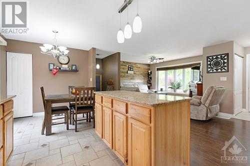 Kitchen offers open sightlines to living and dining areas - 9334 Branch Road, North Augusta, ON - Indoor Photo Showing Dining Room