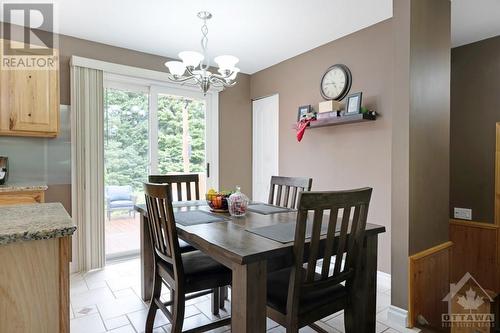 Dining area patio doors to expansive decking - 9334 Branch Road, North Augusta, ON - Indoor Photo Showing Dining Room