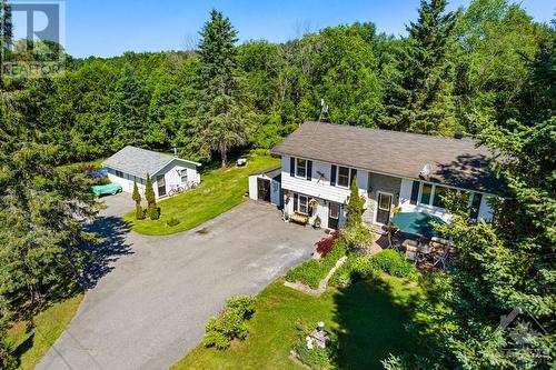 Welcoming home with detached heated garage-workshop and, deeded access to Mississippi Lake sandy beach and boat launch - 124 Second Avenue, Carleton Place, ON - Outdoor