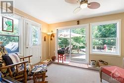 Sunroom has door and patio doors to deck - 