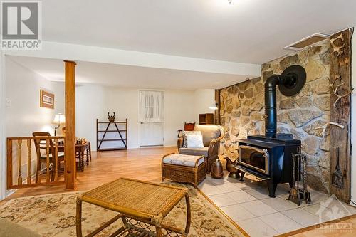 Lower level family room has flex space - 124 Second Avenue, Carleton Place, ON - Indoor Photo Showing Living Room With Fireplace