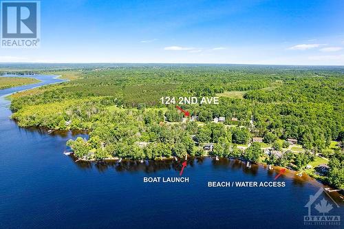 Located in Rothwell Park with short walk to the community's private sandy beach and boat launch - 124 Second Avenue, Carleton Place, ON - Outdoor With Body Of Water With View