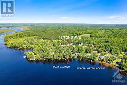 Located in Rothwell Park with short walk to the community's private sandy beach and boat launch - 