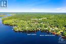 Located in Rothwell Park with short walk to the community's private sandy beach and boat launch - 124 Second Avenue, Carleton Place, ON  - Outdoor With Body Of Water With View 