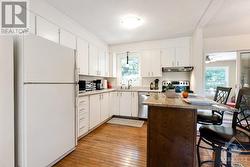 White bright kitchen with convenient island-breakfast bar - 