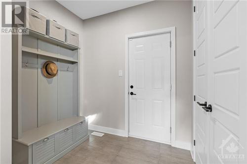 Mud room w/ inside access to garage & includes double door closet. - 68 Hubble Heights, Ottawa, ON - Indoor Photo Showing Other Room