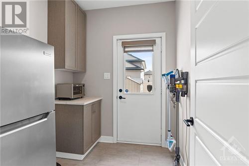 Butler's pantry w/ access to the backyard- great for storage and additional appliances. - 68 Hubble Heights, Ottawa, ON - Indoor