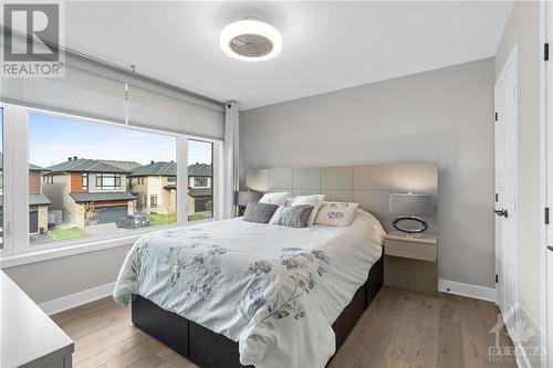 Bedroom 3 w/ double closet and expansive wall-to-wall window. - 68 Hubble Heights, Ottawa, ON - Indoor Photo Showing Bedroom