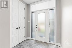 Tiled front foyer w/ double closet. - 