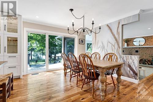 Kitchen dinette with patio doors to expansive wrap-about deck - 3108 Beckwith 9Th Line, Carleton Place, ON - Indoor Photo Showing Dining Room