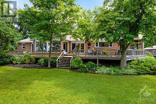 Expansive wrap-about deck overlooks the lake - 3108 Beckwith 9Th Line, Carleton Place, ON - Outdoor With Deck Patio Veranda