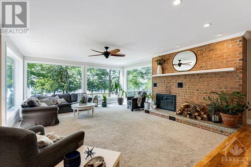 Great Room spectacular full, panoramic views of the lake and sunsets - 3108 Beckwith 9Th Line, Carleton Place, ON - Indoor Photo Showing Other Room With Fireplace