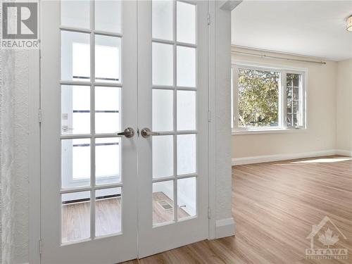 Greeted with French Doors from Foyer to Living. - 1989 Naples Avenue, Ottawa, ON - Indoor Photo Showing Other Room