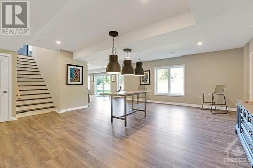 take the stairs down to the open lower level games room. Lights already in place for pool table - 1608 Nolans Road, Montague, ON - Indoor